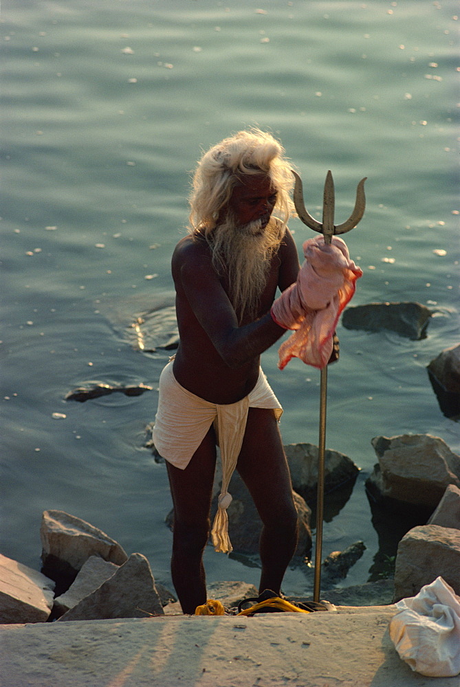 Sadhu with trident, a symbol of the god Vishnu, Varanasi, Uttar Pradesh state, India, Asia