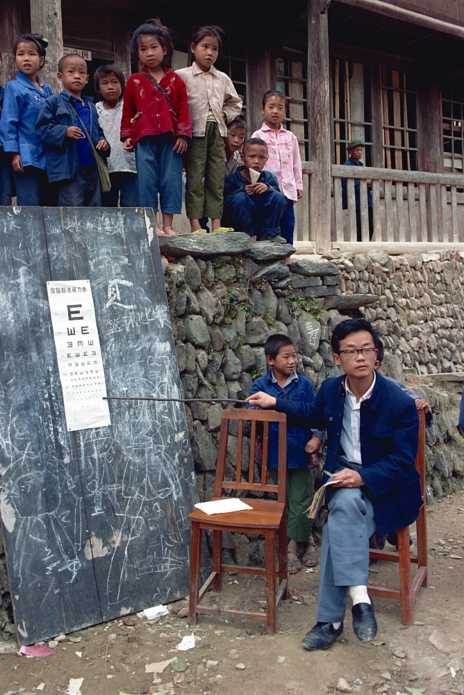 Eye testing in a Dong village school, China, Asia