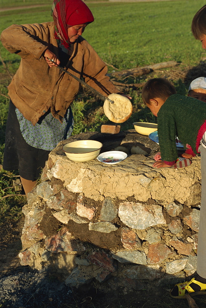 Kazak cooking bread, Tianshan, Xinjiang, China, Asia