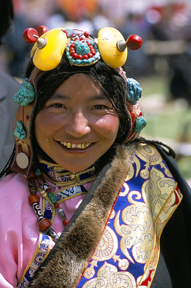 Young woman wearing typical amber jewellery, Yushu Horse Fair, Qinghai Province, China, Asia