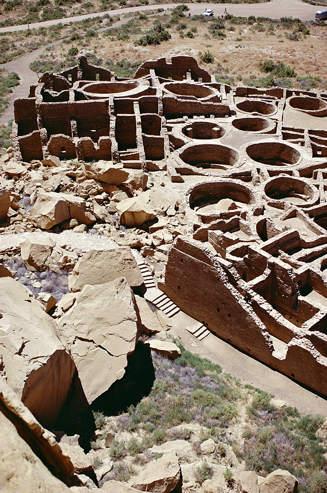 Kivas and rooms, foreground rock fall destroyed part of pueblo, Pueblo Bonito 1000-1100 AD, Anasazi site, Chaco Canyon National Monument, New Mexico, United States of America (U.S.A.), North America