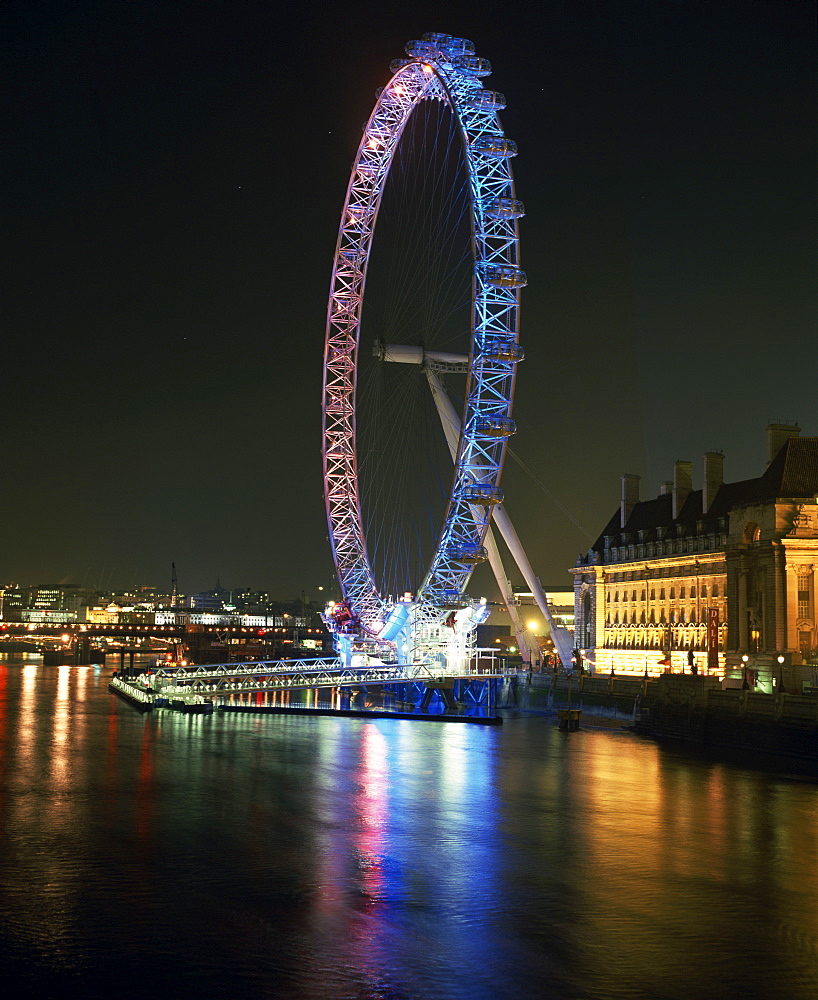 London Eye illuminated by moving coloured lights, London, England, United Kingdom, Europe