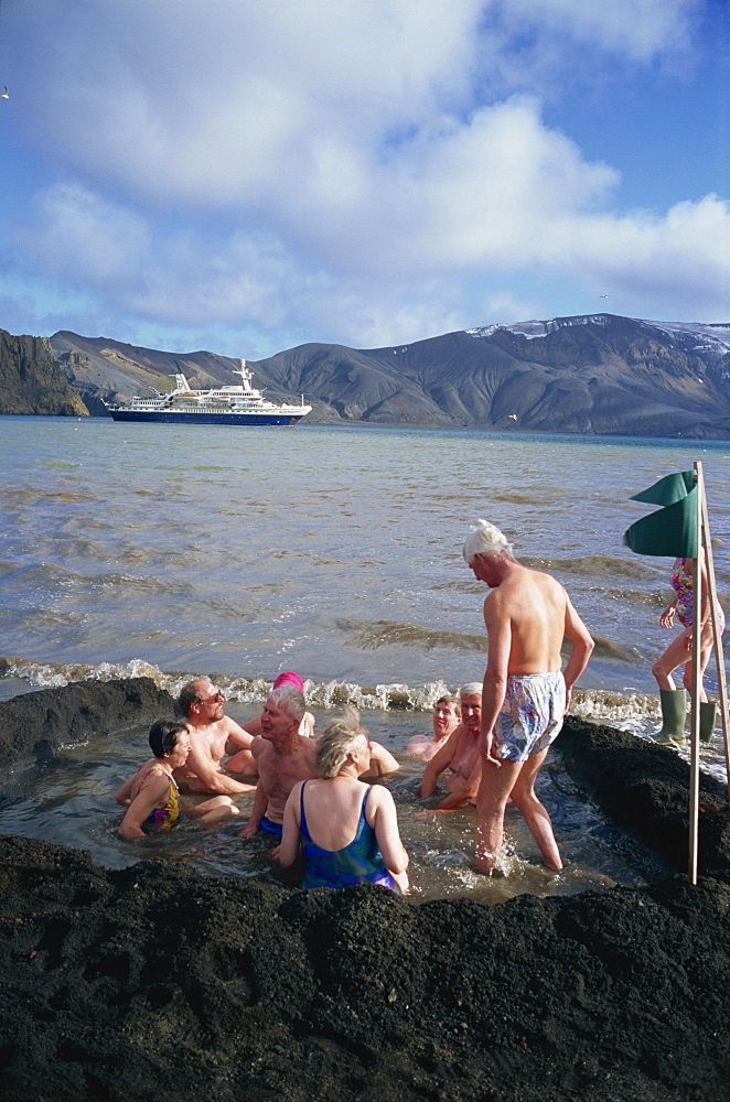 Tourists bathing in warm volcanic waters, Deception Island, South Shetland Islands, Antarctica, Polar Regions