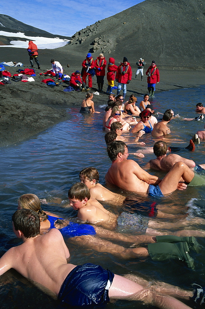 Cruise ship passengers bathing in sea warmed by volcanic activity, Deception Island, Antarctic Peninsula, Antarctica, Polar Regions