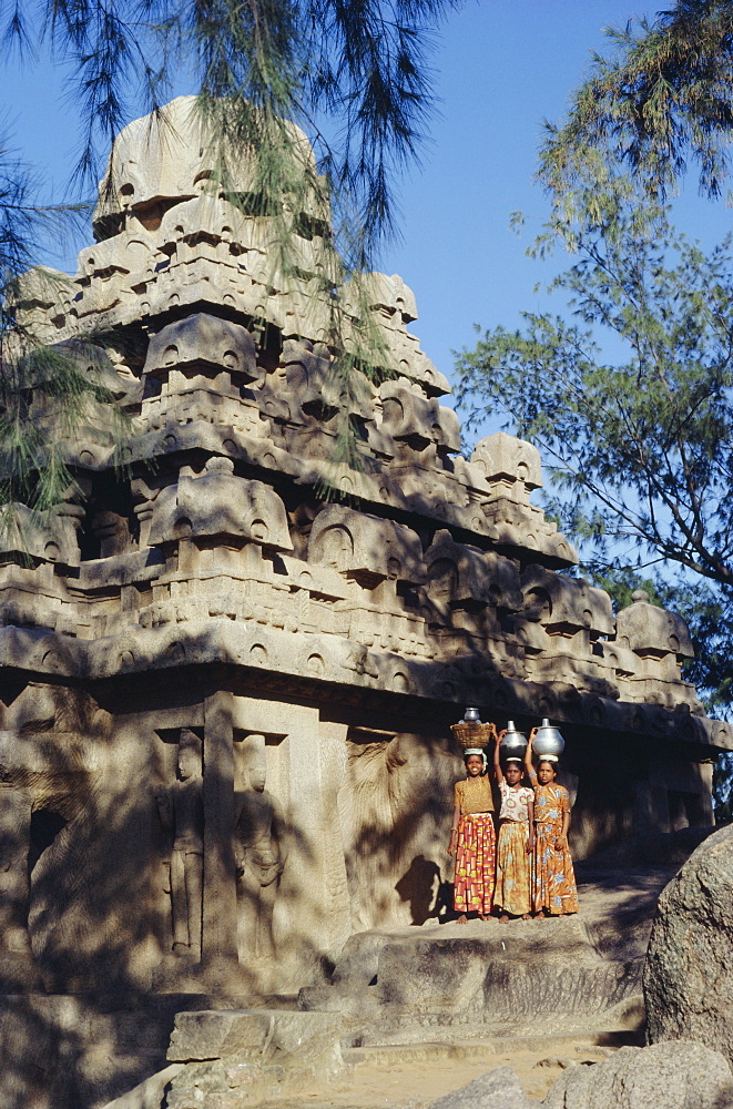 Three girls carrying water pots, Mahabalipuram (Mamallapuram), Tamil Nadu, India