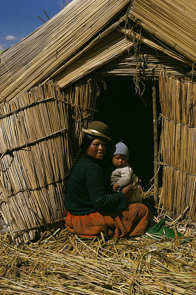 Uro Indian woman and baby, Lake Titicaca, Peru, South America