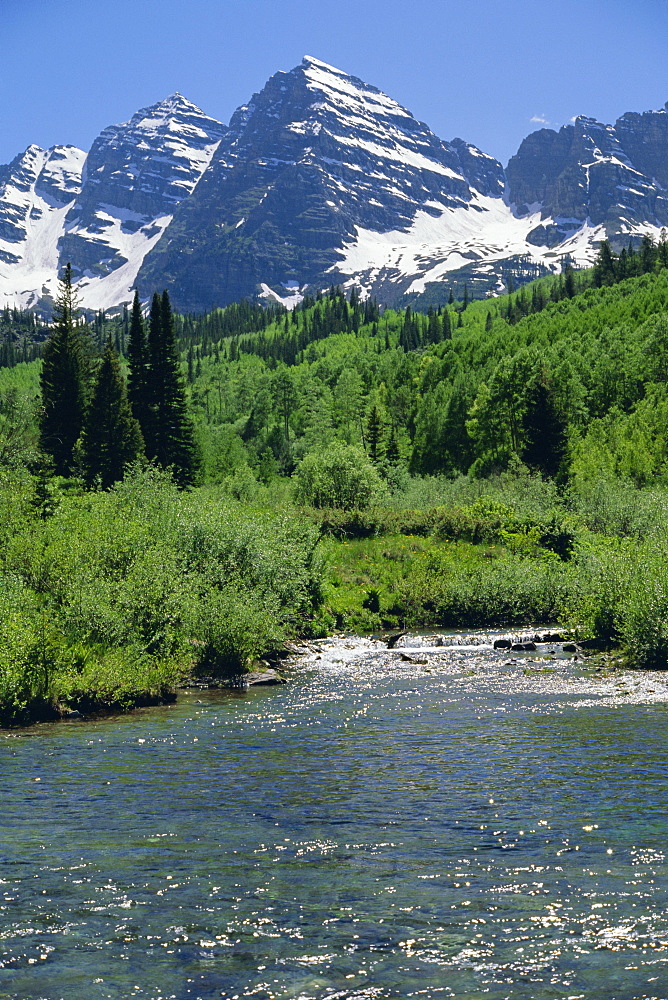 Maroon Bells seen from stream rushing to feed Maroon Lake nearby, Aspen, Colorado, Rocky Mountains, USA, North America