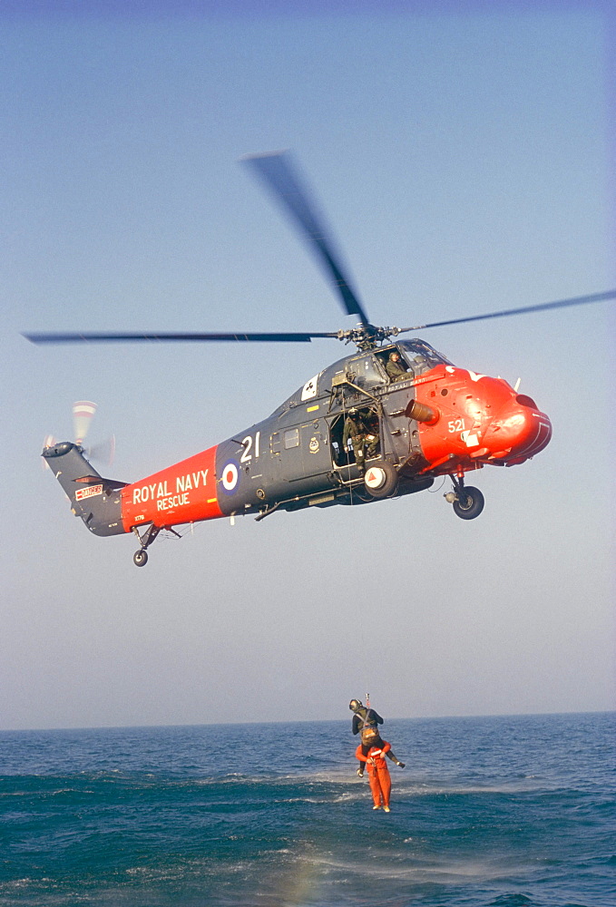 Wessex helicopter winching up survivior in rescue from sea