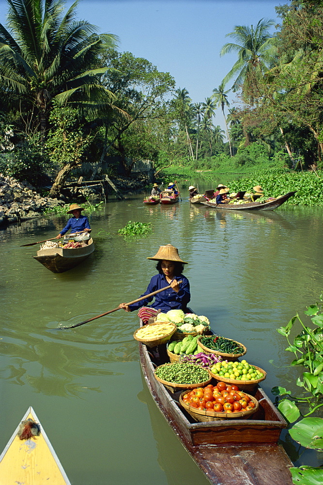 Women in canoes on way to floating market, Thailand, Southeast Asia, Asia