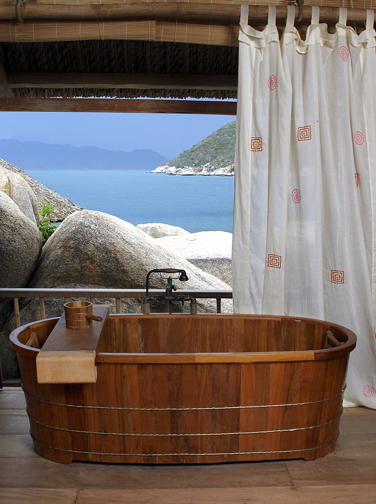 Bathroom with a wooden tub at the Evason Hideaway Resort and Spa in Nha Trang, Vietnam, Indochina, Southeast Asia, Asia