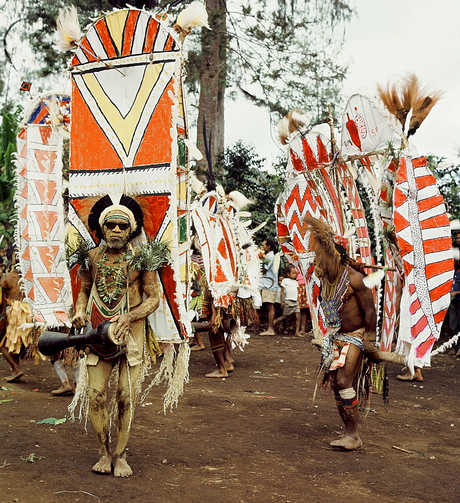 Asaro tribesmen photographed in 1974 in full costume for a rital display of wealth, Goroka, Papua New Guinea, Pacific