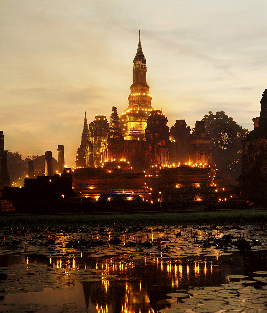 Temple illuminated during Loy Krathong Festival, Sukhothai, Thailand, Southeast Asia, Asia