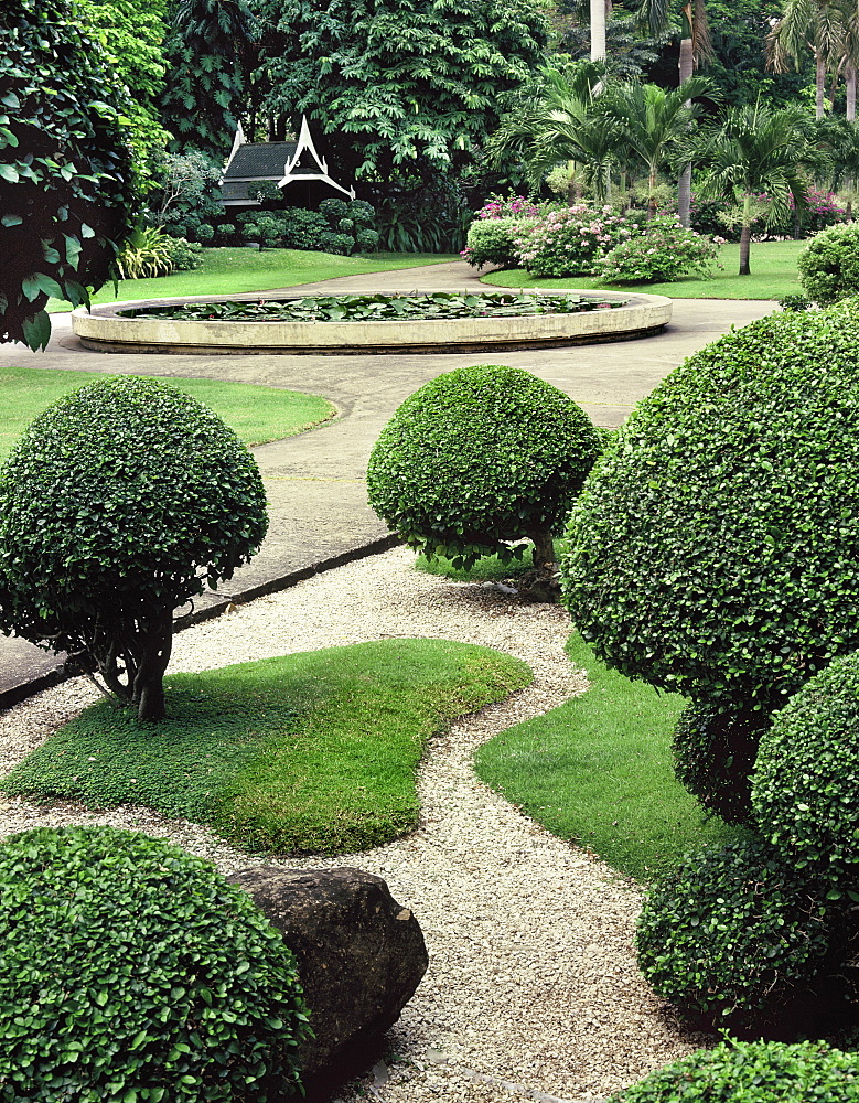 A classic traditional Thai garden in Bangkok, with clipped trees, Bangkok, Thailand, Southeast Asia, Asia