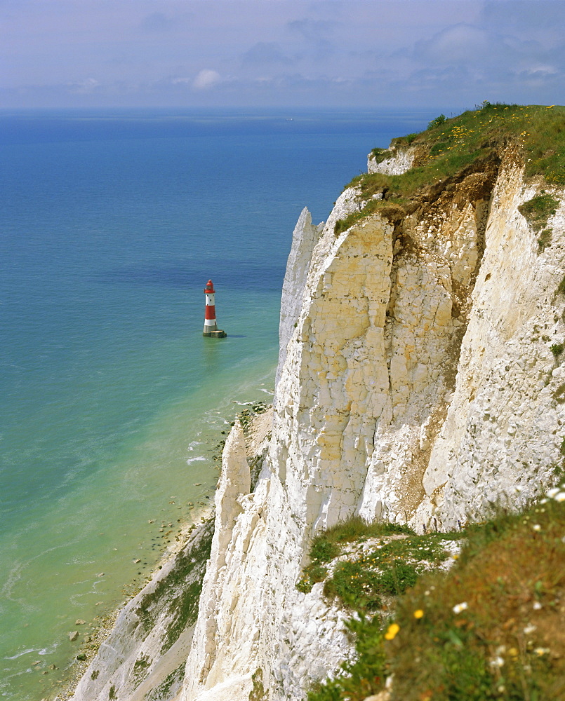 Lighthouse and chalk cliffs at Beachy Head, near Eastbourne, East Sussex, England, UK