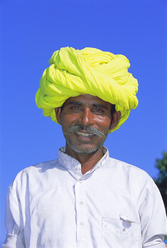 Portrait of a man in a yellow turban, Pushkar, Rajasthan State, India, Asia