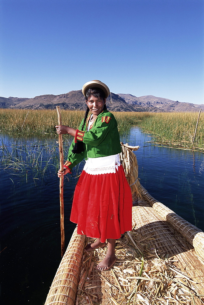 Portrait of a Uros Indian woman on a traditional reed boat, Islas Flotantes, floating islands, Lake Titicaca, Peru, South America