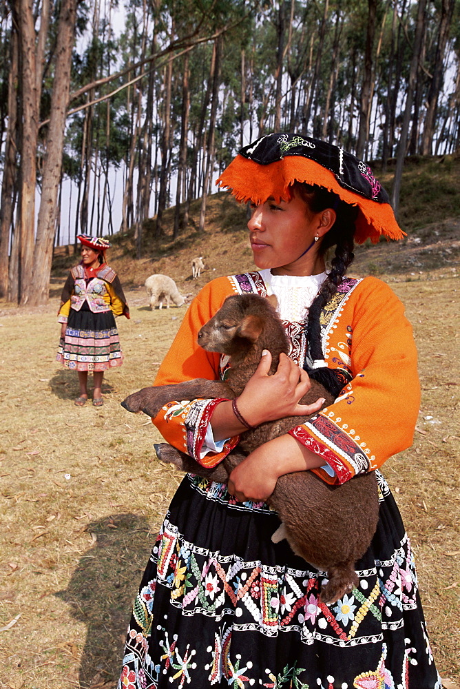 Portrait of a local Peruvian young woman in traditional dress, Cuzco (Cusco), Peru, South America