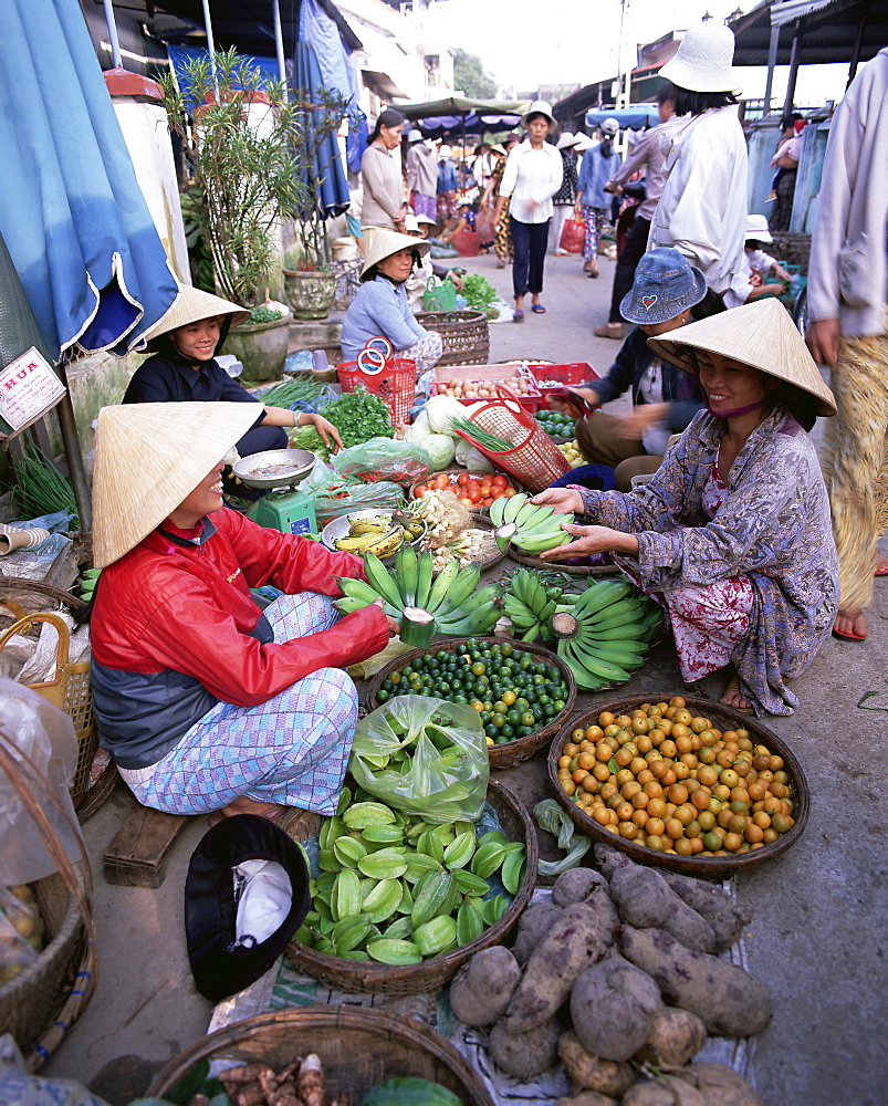 Women in conical hats selling fruit and vegetables in busy Central market, Hoi An, Central Vietnam, Vietnam, Indochina, Southeast Asia, Asia