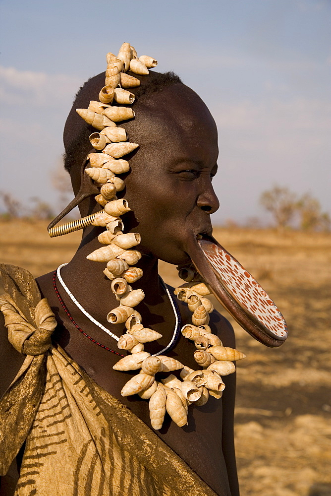 Portrait of a Mursi woman with clay lip plate, Mursi Hills, Mago National Park, Lower Omo Valley, Ethiopia, Africa