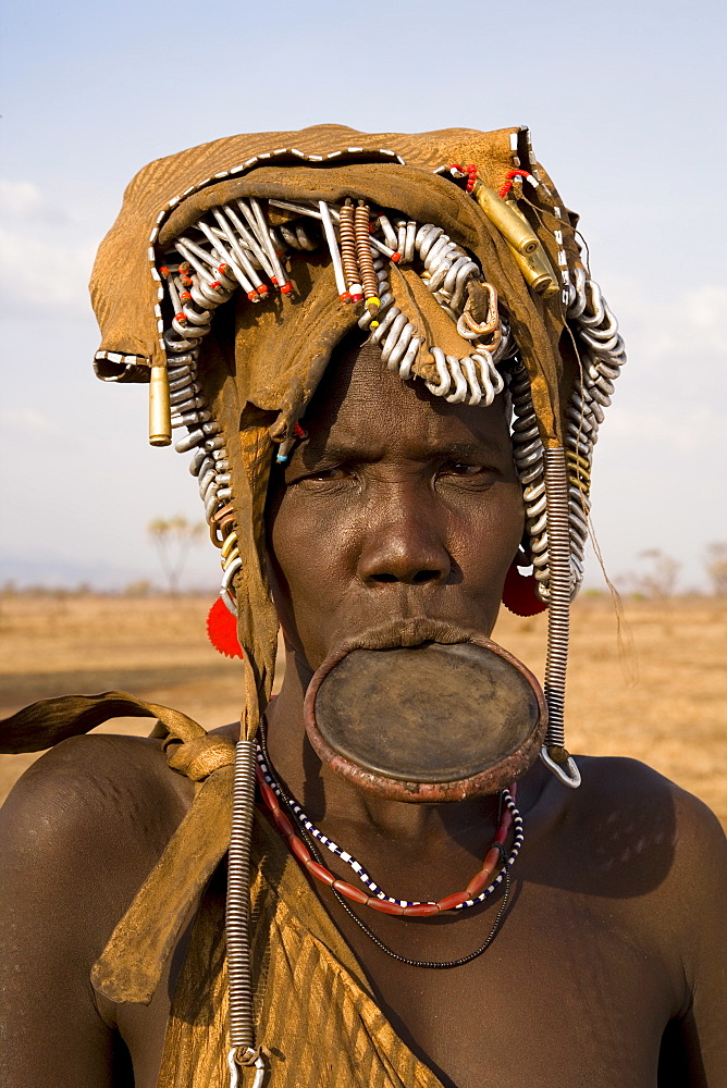 Portrait of a Mursi woman with clay lip plate, Mursi Hills, Mago National Park, Lower Omo Valley, Ethiopia, Africa