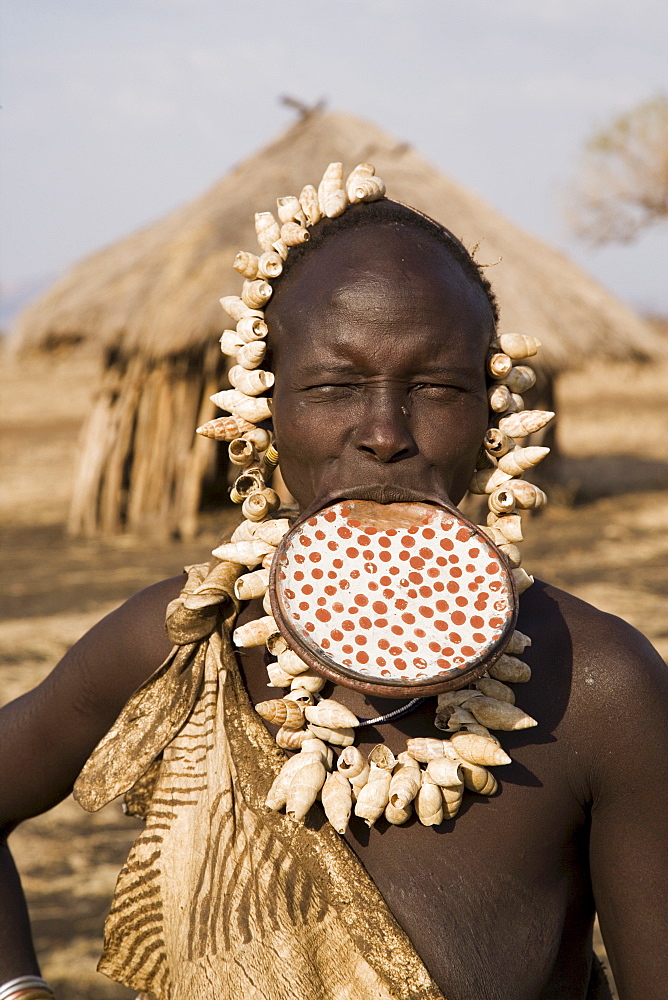 Portrait of a Mursi woman with clay lip plate, Mursi Hills, Mago National Park, Lower Omo Valley, Ethiopia, Africa