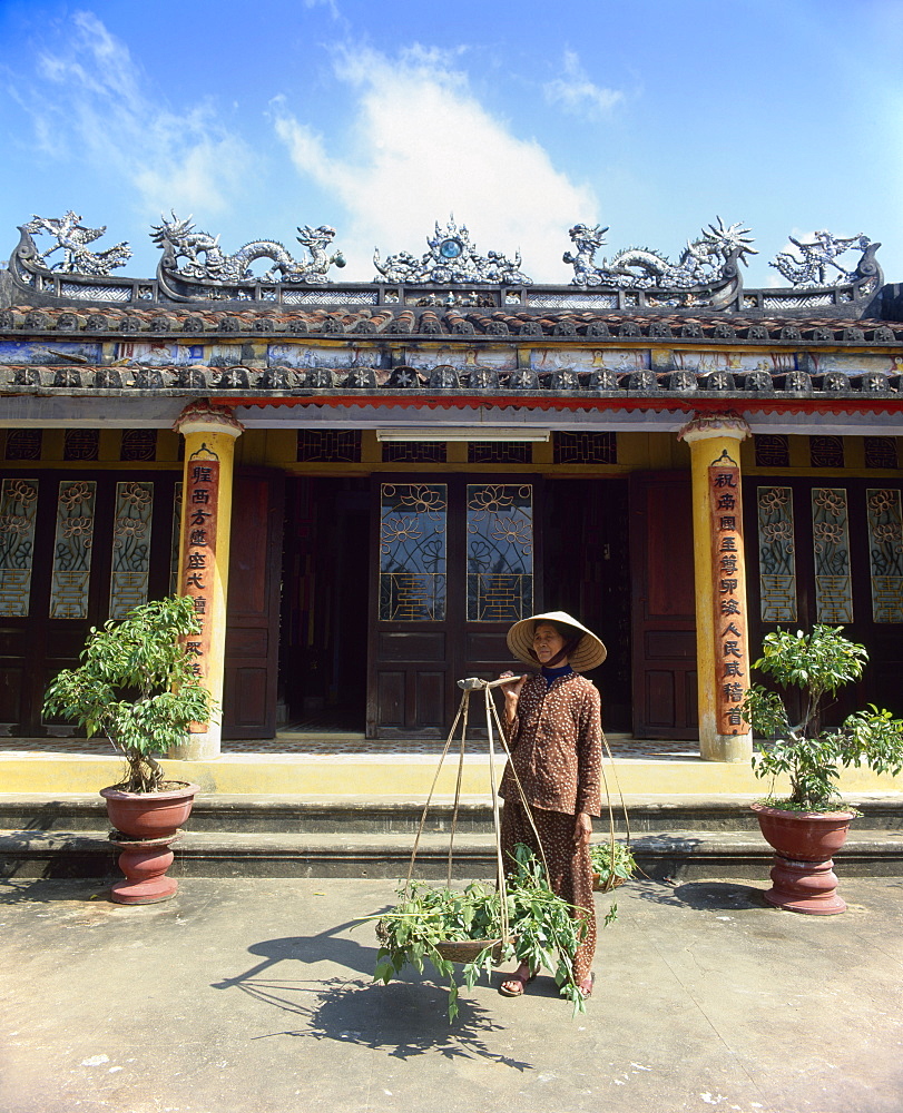 Senior woman by Chuc Thanh Pagoda, Hoi An, Vietnam, Indochina, Southeast Asia, Asia