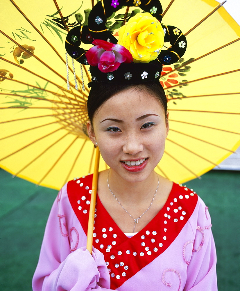 Portrait of a young woman holding parasol, smiling,Yangtze River, Chongqing, Chongqing City, Sichuan Province, China, Asia