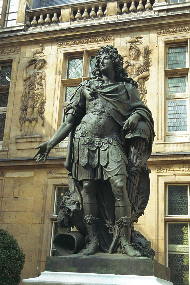 Statue of Louis XIV outside the Renaissance building of the Hotel Carnavalet, Le Marais, Paris, France, Europe