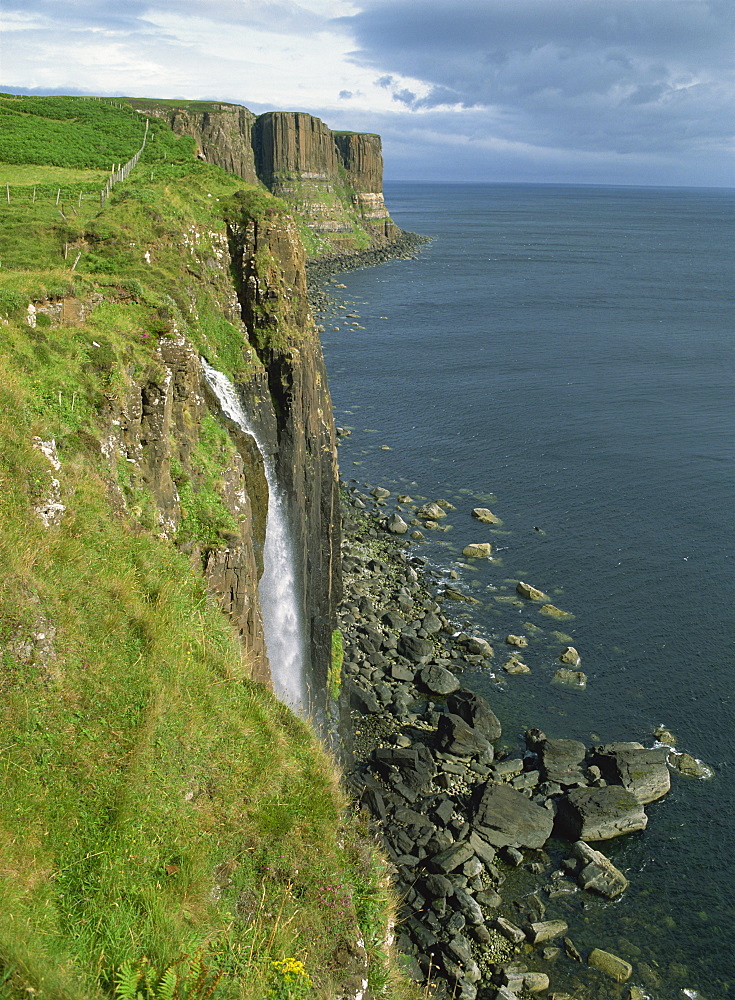 Waterfall over cliff into the sea, The Kilt Rock, Isle of Skye, Scotland, United Kingdom, Europe