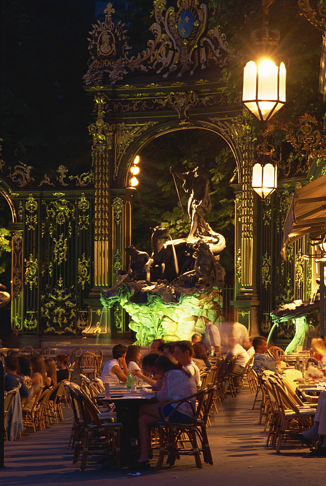 Pavement cafe at night in the Place Stanislas in Nancy, UNESCO World Heritage Site, Meurthe et Moselle, Alsace Lorraine, France, Europe