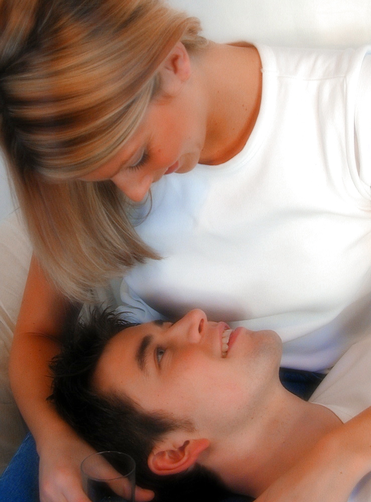 Man lying down talking to his partner