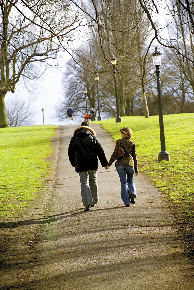 Young couple walking on Primrose Hill, London, England, United Kingdom, Europe