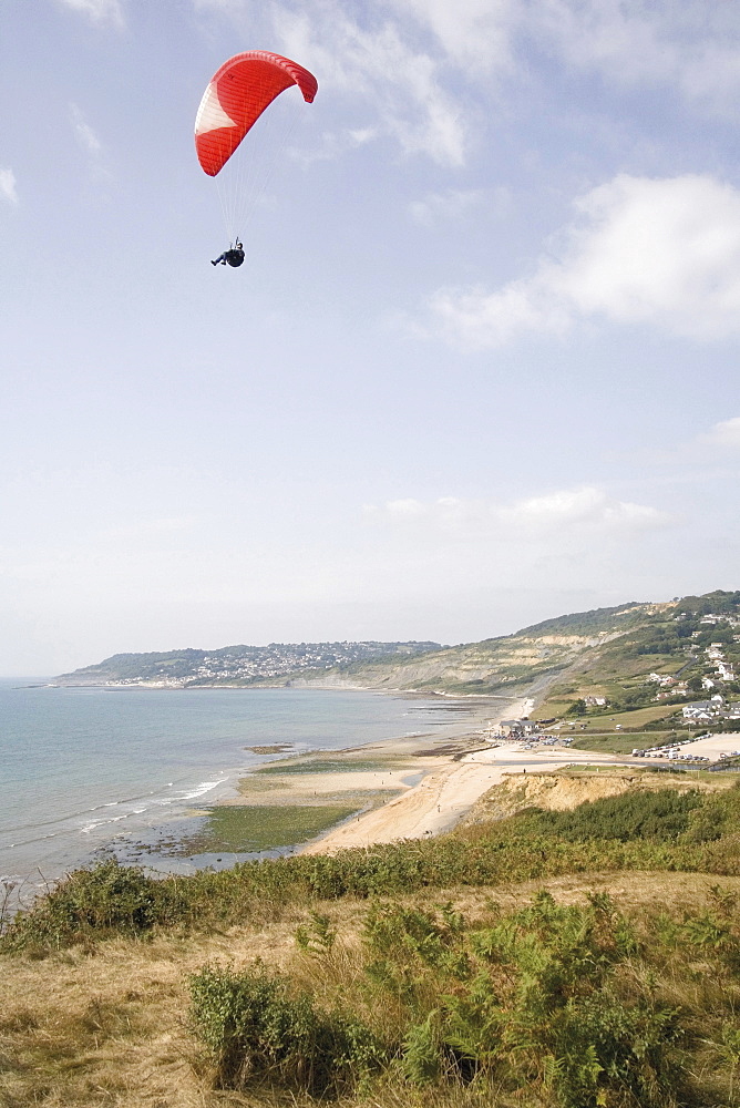 Hang glider over the Jurassic Coast, UNESCO World Heritage Site, Charmouth, Dorset, England, United Kingdom, Europe