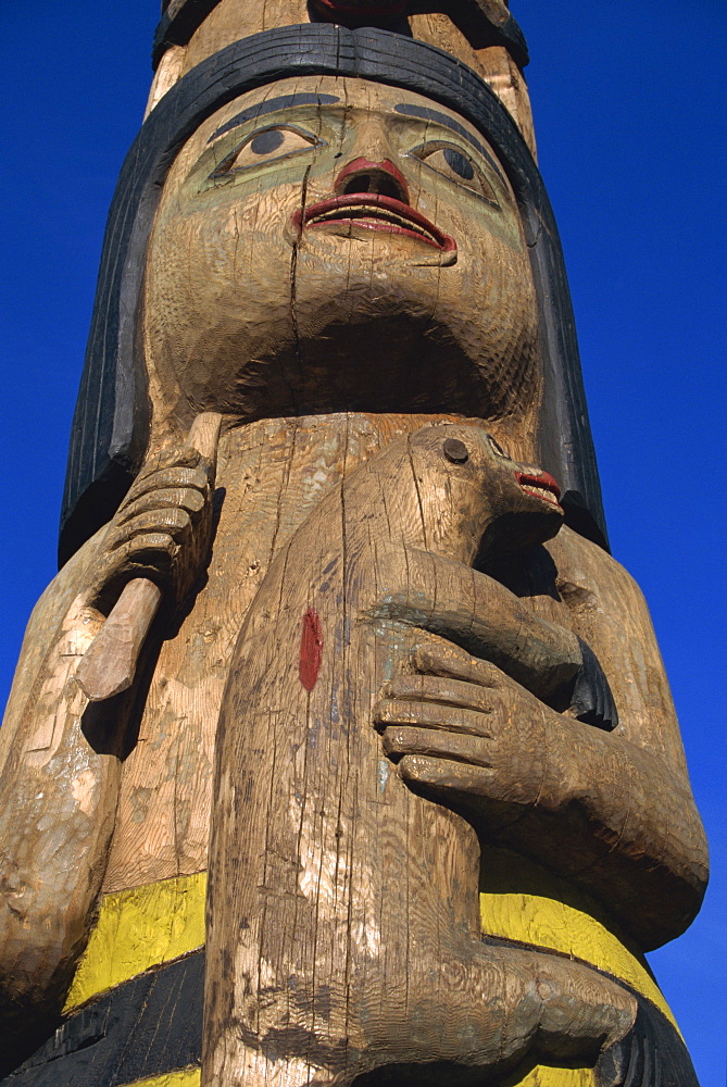 Totem pole of Shaman and land otter, carved in red cedar in 1940 by John Wanlace, Inside Passage, Juneau, Alaska, United States of America, North America