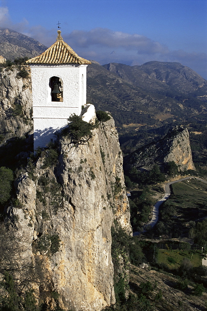 Bell tower in village built on steep limestone crag, Guadalest, Costa Blanca, Valencia region, Spain, Europe