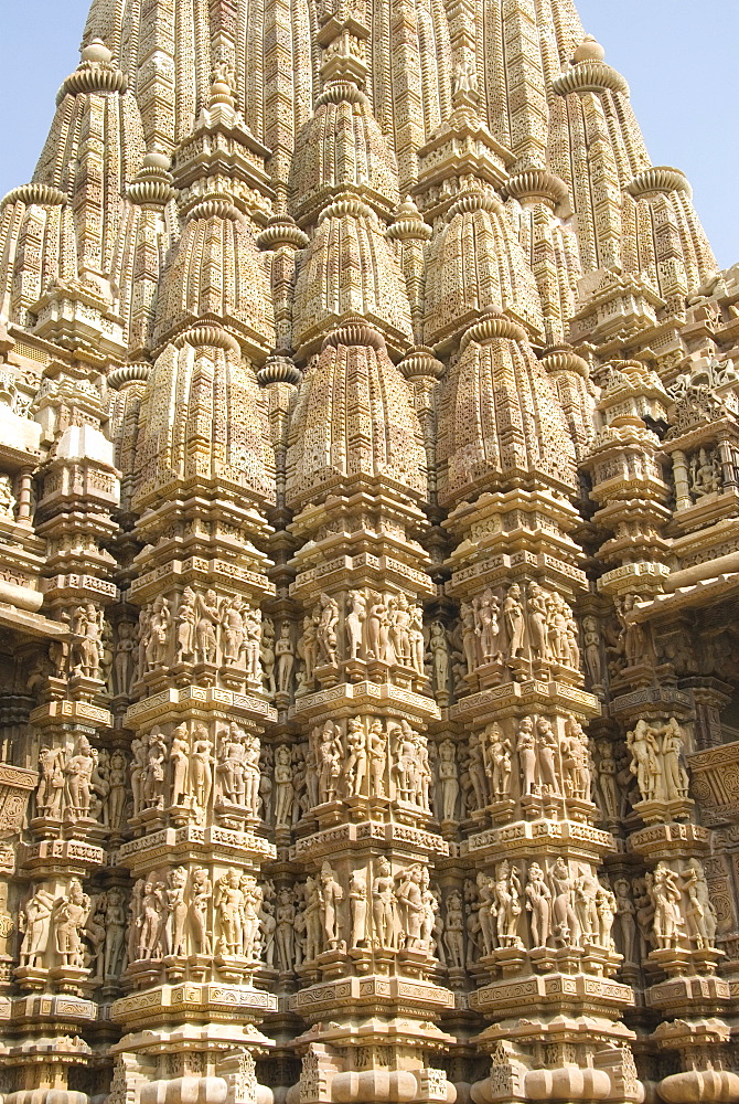 Detail of the main spire with some of the 646 erotic figures carved in sandstone on the Kandariya Mahadeva Temple, largest of the Chandela temples, within Western Group, Khajuraho, UNESCO World Heritage Site, Madhya Pradesh state, India, Asia