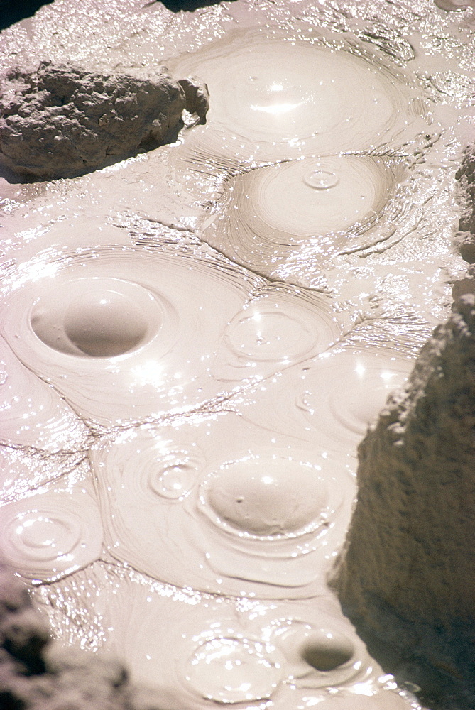 Blisters measuring about 10 cm across in boiling mud pool, Mud volcano, Yellowstone National Park, UNESCO World Heritage Site, Wyoming, United States of America (U.S.A.), North America