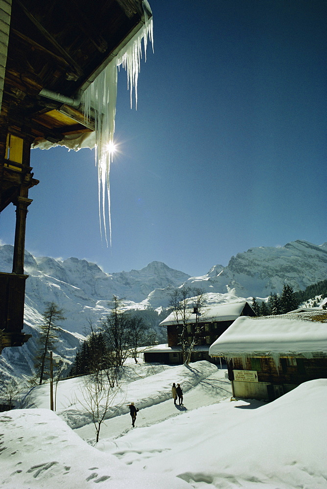 Icicles on chalet and deep snow, Swiss Alps, Switzerland, Europe