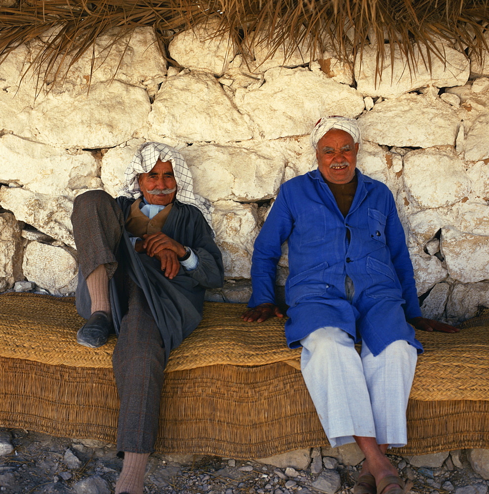 Two men relaxing in shade, Tunisia, North Africa, Africa