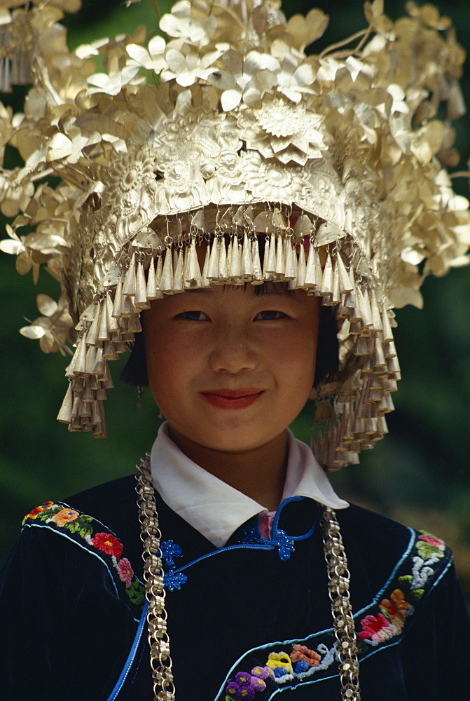 Miao girl wearing traditional silver head dress, Leishan Festival, Guizhou Province, China, Asia