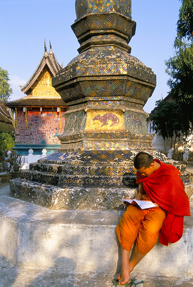 Buddhist monk reading a book, Wat Xieng Thong, Luang Prabang, Laos, Indochina, Southeast Asia, Asia