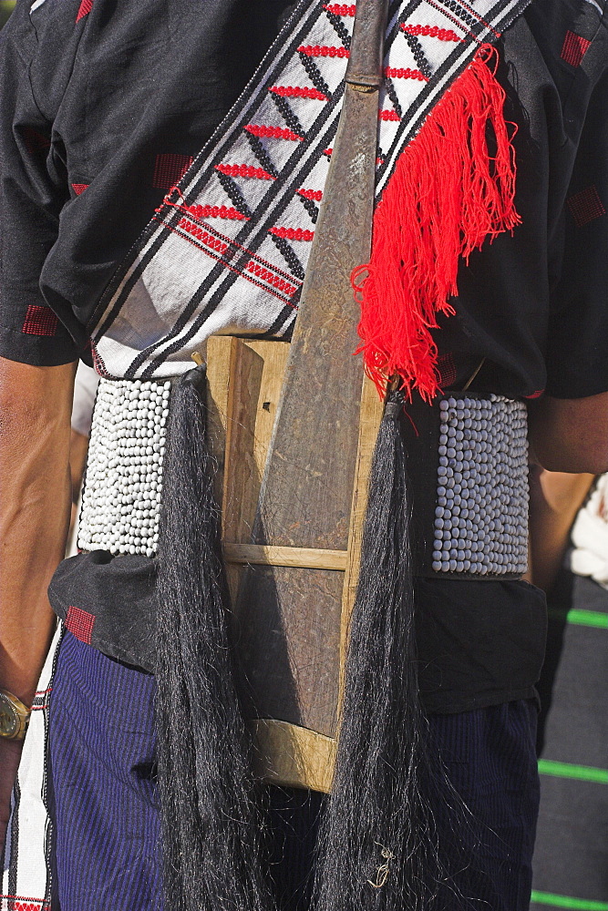 Naga man wearing belt with dao holder also known as Dhama (a type of machete) Naga New Year Festival, Lahe village, Sagaing Division, Myanmar (Burma), Asia