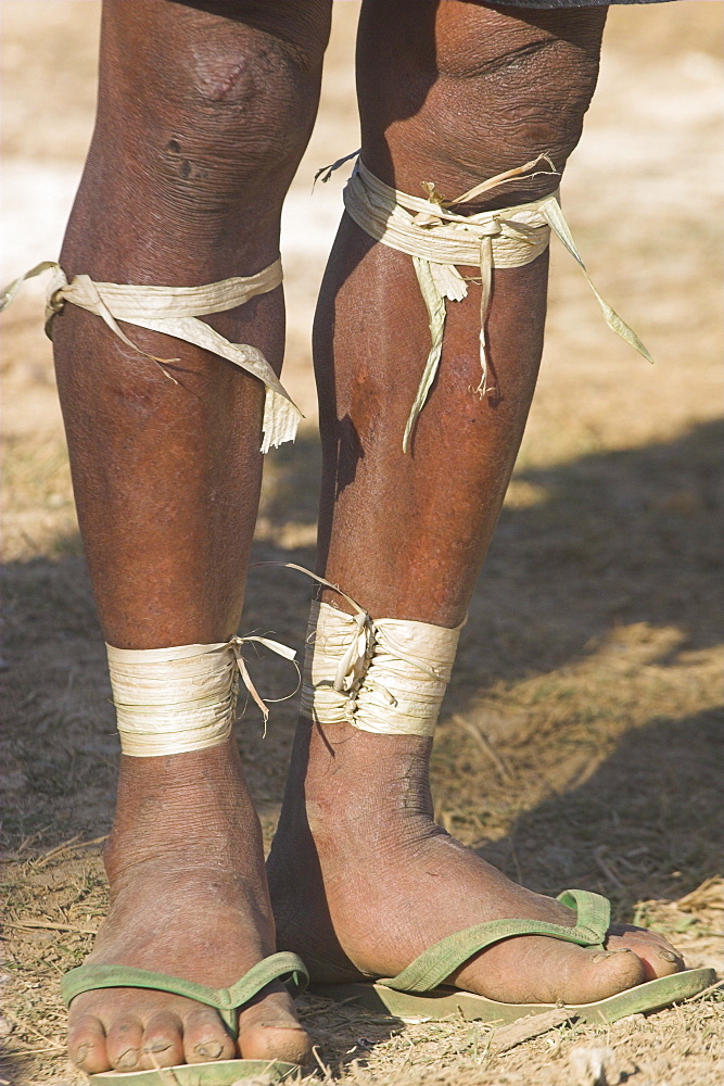 Legs of Naga man with bamboo wrapped round, Naga New Year Festival, Lahe village, Sagaing Division, Myanmar (Burma), Asia