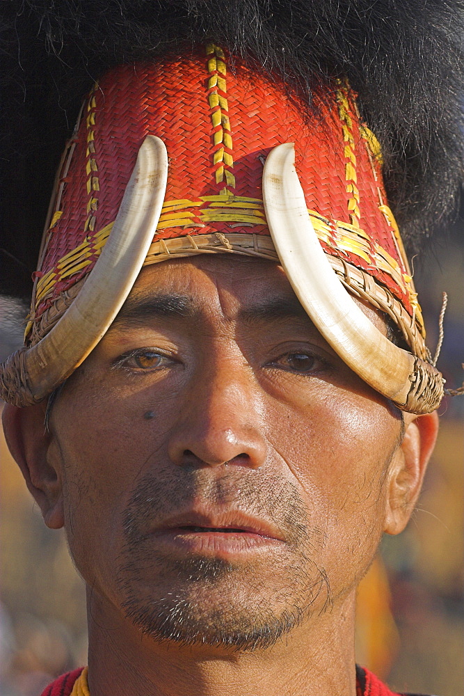 Naga man wearing headdress made of woven cane decorated with wild boar teeth and bear fur, Naga New Year Festival, Lahe village, Sagaing Division, Myanmar (Burma), Asia