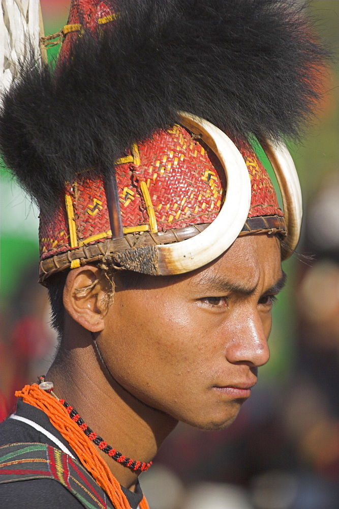 Naga man wearing headdress made of woven cane decorated with wild boar teeth and bear fur, Naga New Year Festival, Lahe village, Sagaing Division, Myanmar (Burma), Asia