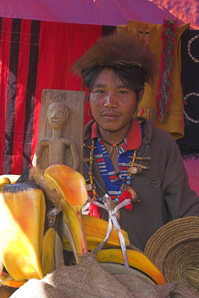 Naga man selling hornbill beaks, Naga New Year Festival, Lahe village, Sagaing Division, Myanmar (Burma), Asia 