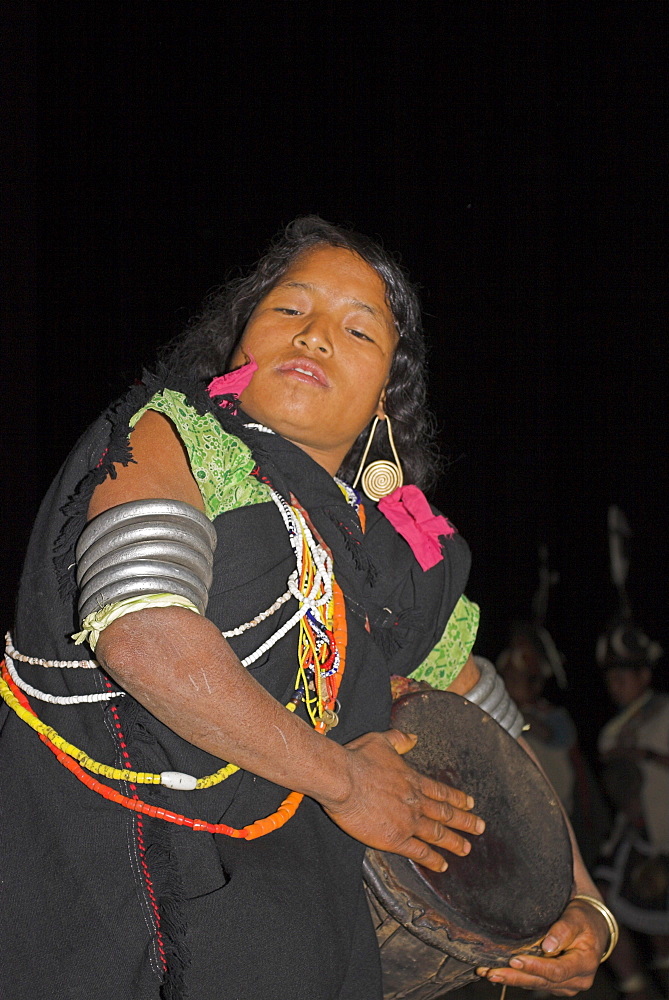 Naga lady dancing and playing drum, Naga New Year Festival, Lahe village, Sagaing Division, Myanmar (Burma), Asia