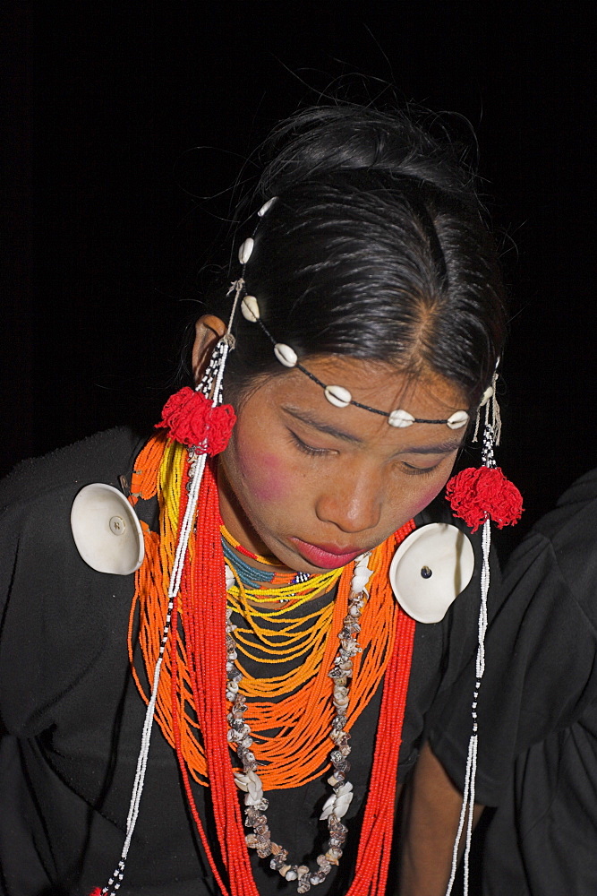 Naga lady wearing conch shell earings dancing, Lahe village, Sagaing Division, Myanmar (Burma), Asia