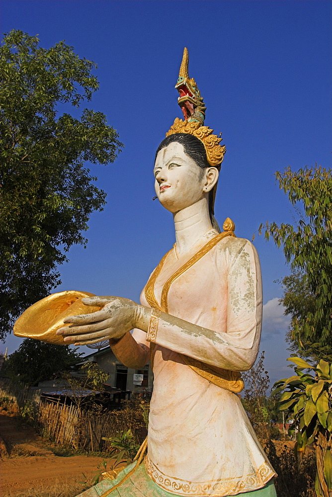 Statue opposite  Wat Jong Kham thought to date from the 13th century, Kengtung (Kyaing Tong), Shan State, Myanmar (Burma), Asia