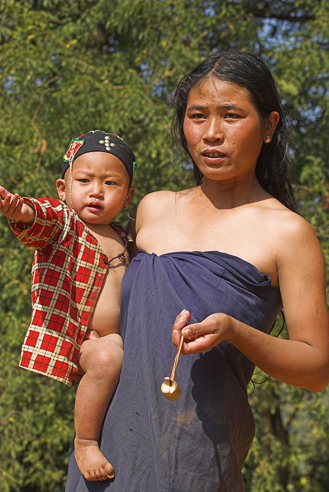 Wan Sai village (Aku tribe) Aku lady with baby, Kengtung (Kyaing Tong), Shan State, Myanmar (Burma), Asia